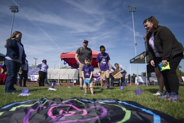 Two-year-old Nicholas Kelley aims for the beanbag bullseye April 20 on Gerlach Field during one of Fort Leonard Wood’s largest Month of the Military Child events, MOMC-Palooza.