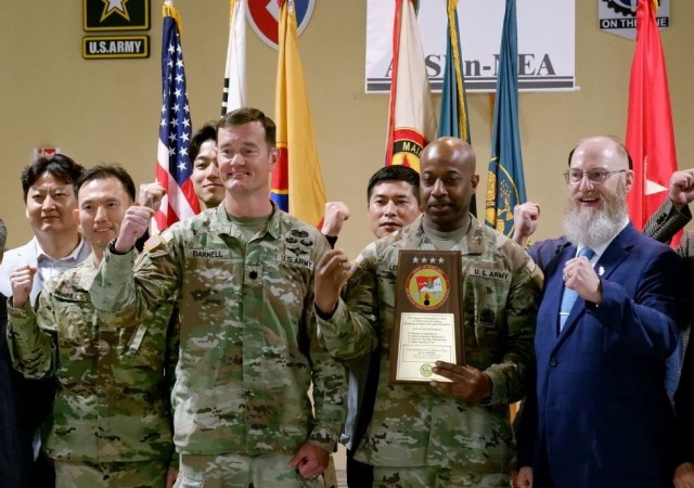 Lt. Col Justin Darnell and personnel from the AFSBn-K display the runner up Army Award for Maintenance Excellence plaque during a ceremony on Camp Carroll, Korea, April 18th.