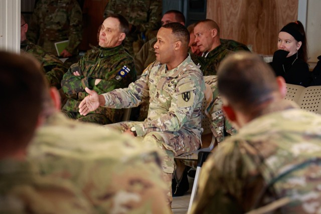 U.S. Army Maj. Gen. Ronald Ragin, commanding general, 21st Theater Sustainment Command, speaks to U.S. Army, Norwegian army, and Finnish army Soldiers at a rehearsal of concept (ROC) drill in Narvik, Norway, on April 23, 2024. A ROC drill is a walk-through of a plan between a commander and participants, ensuring a shared understanding of the plan. The ROC drill is a precursor to port operations and onward movement of equipment during DEFENDER 24. DEFENDER is the Dynamic Employment of Forces to Europe for NATO Deterrence and Enhanced Readiness, and is a U.S. European Command scheduled, U.S. Army Europe and Africa conducted exercise that consists of Saber Strike, Immediate Response, and Swift Response. DEFENDER 24 is linked to NATO’s Steadfast Defender exercise, and DoD’s Large Scale Global Exercise, taking place from 28 March to 31 May. DEFENDER 24 is the largest U.S. Army exercise in Europe and includes more than 17,000 U.S. and 23,000 multinational service members from more than 20 Allied and partner nations, including Croatia, Czechia, Denmark, Estonia, Finland, France, Germany, Georgia, Hungary, Italy, Latvia, Lithuania, Moldova, Netherlands, North Macedonia, Norway, Poland, Romania, Slovakia, Spain, Sweden, and the United Kingdom.  (U.S. Army photo by Spc. Samuel Signor)