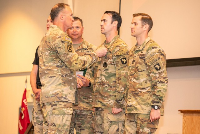 U.S. Army Engineer School Commandant Col. Joseph Goetz and USAES Regimental Command Sgt. Maj. Zachary Plummer present Capts. Matthew Cushing and Joseph Palazini with Meritorious Service Medals during the 2024 Best Sapper Competition awards...