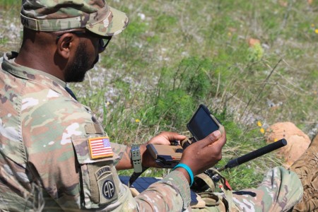 Sgt. 1st Class Dirk Faison uses a handheld controller to get unmanned aerial systems camera feed to call for fire during Operation Smokehouse at Fort Sill&#39;s Thompson Hill Range Complex. Integrating UAV camera feed to a call for fire and transmitting digitally back to the Fire Support Team improves the survivability and effectiveness of forward observers in large-scale combat operations.