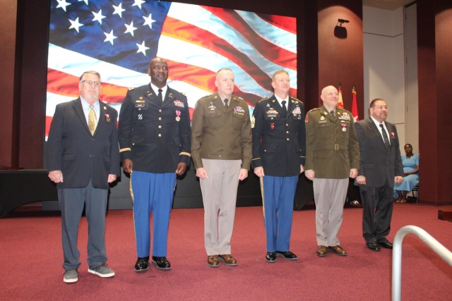 From left are retiree Bruce Cline, retiree Col. Oscar Doward, Army Materiel Command Chief of Staff Maj. Gen. Walt Duzzny, Garrison Command Sgt. Maj. Dylan Lemasters, retiree Col. George Crockatt and retiree Carlos Sacarello. 