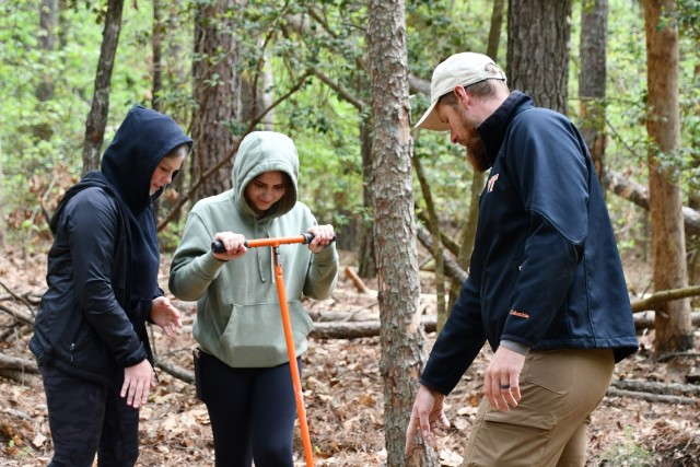 Earth Day Returns to Fort Walker with Students from Caroline County Schools / students dig an earth sample with instructor. 