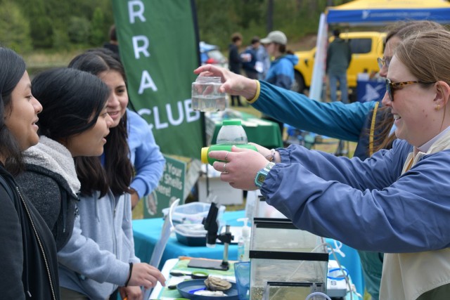 Earth Day Returns to Fort Walker with Students from Caroline County Schools / students look at small freshwater fish.