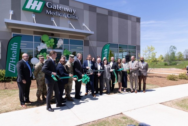 Huntsville Mayor Tommy Battle and Madison Mayor Paul Finley join representatives from Redstone Arsenal, Huntsville Hospital, along with other community leaders, during a ribbon cutting ceremony on April 23.