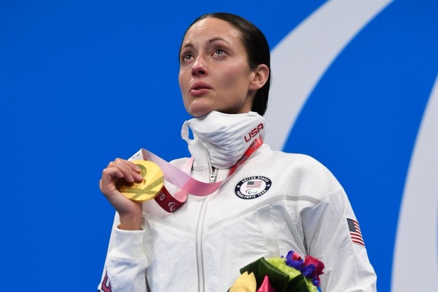 Para-swimmer Sgt. 1st Class Elizabeth Marks clutches her gold medal during the medal ceremony of the women’s 100-meter backstroke, S6, Marks broke the world record with a time of 1:19.57 on Sept. 4, 2021. Marks medaled in three events at the...