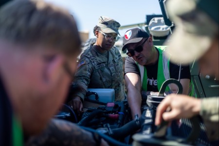 Pfc. Ayana Thompson, assigned to the 43rd Multi-Role Bridge Company, 20th Engineer Battalion, and Dominique Maes, a host nation Department of Defense civilian employee from Army Field Support Battalion-Benelux conduct preventiv...