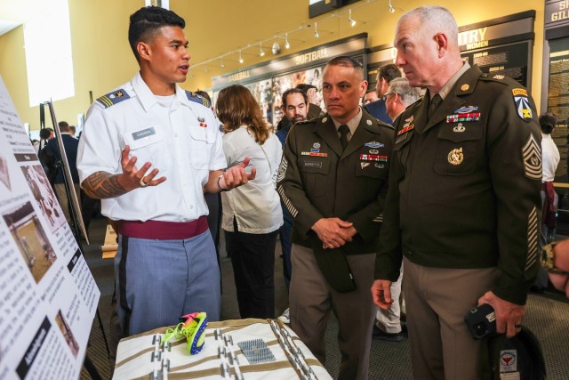 Command Sgt. Maj. Brian Hester, Army Futures Command and Command Sgt. Maj. Phil Barretto, United States Military Academy Command Sergeant Major, receive cadet briefings during the United States Military Academy’s annual Projects Day Research Symposium at West Point, N.Y. on May 2, 2024. This year’s symposium had over 450 projects presented in varying stages of development on topics ranging from rocketry to artificial intelligence. 