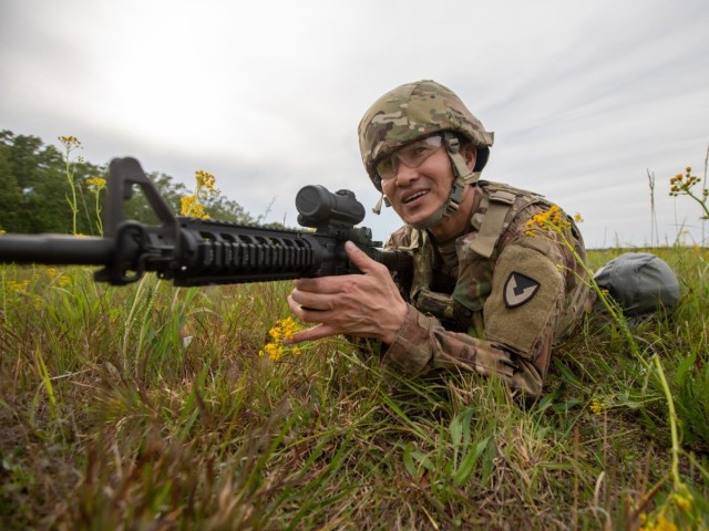 Sgt. 1st Class Sungkoo Jung, a contracting NCO with the 418th Contracting Support Brigade and assigned to the 902nd Contracting Battalion at Joint Base Lewis-McChord, Washington, competes in warrior tasks May 9 at Tullahoma Volunteer Training...