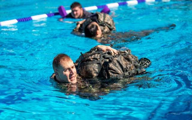 Capt. Michael Johnson completes a water survival drill during the 2023 Best Medic Competition at Fort Johnson, Louisiana, Jan. 22, 2023. Johnson combines his love of medicine and tactical operations whenever he can.