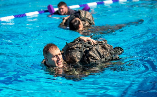 Capt. Michael Johnson completes a water survival drill during the 2023 Best Medic Competition at Fort Johnson, Louisiana, Jan. 22, 2023. Johnson combines his love of medicine and tactical operations whenever he can. 