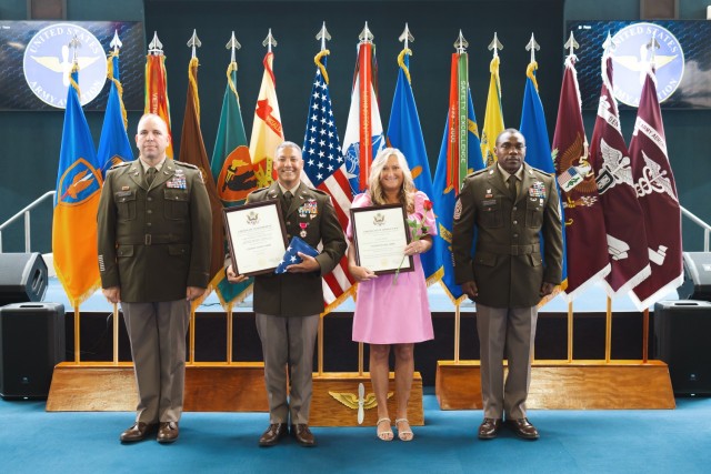 Chief Warrant Officer Four Robert Streit stands with his spouse at the Fort Novosel quarterly retirement ceremony inside the Army Aviation Museum on May 3, 2024.