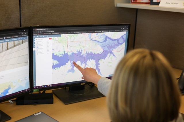 Alexandra Ubben, project manager for the Kansas City District Dam and Levee Data Management Team, looks at a U.S. Army Corps of Engineers inundation map in the National Inventory of Dams in Kansas City, Missouri, on May 7, 2024.