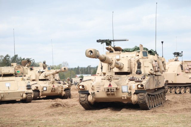 U.S. Army Soldiers assigned to the Ellenwood-based Charlie Battery, 1st Battalion, 214th Field Artillery Regiment, 648th Maneuver Enhancement Brigade, Georgia Army National Guard, move their M109A6 Paladin howitzers in preparation for a convoy to...