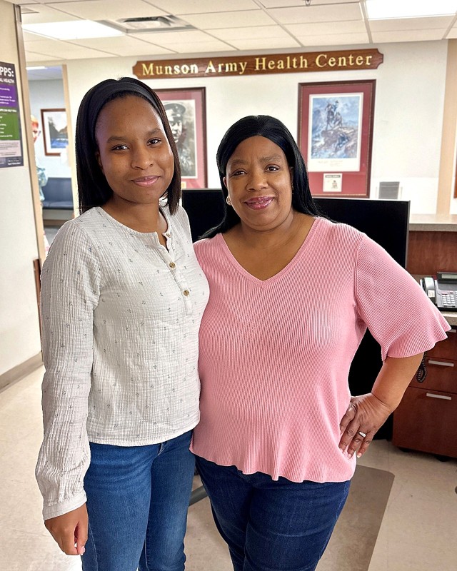 Lisa Dunn Jr. and her mother, Lisa Dunn Sr., both work at Munson Army Health Center at Fort Leavenworth, Kansas. They said they both enjoy assisting Military Health System beneficiaries at MAHC to ensure positive patient experiences. Defense Health Agency photos by Maria. C. Yager