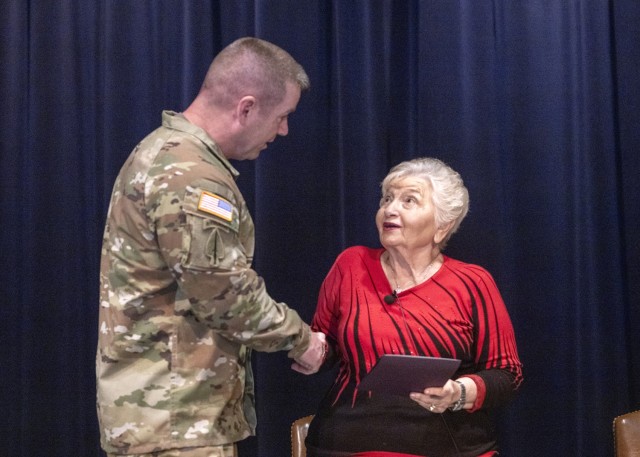 PICATINNY ARSENAL N.J. - Maj. Gen. John T. Reim, Joint Program Executive for Guns and Ammunition and Picatinny Arsenal commanding general, greets Hanna Wechsler during the installation&#39;s Holocaust Remembrance event on May 8.