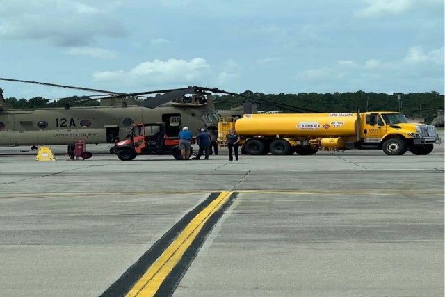 Crews fuel a CH-47 Chinook.