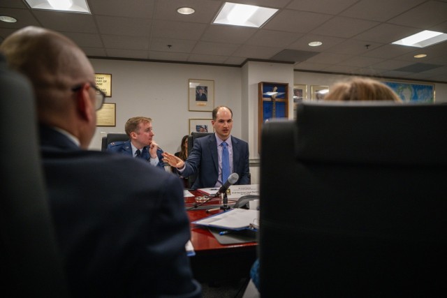 Evan Derrow, the Chief of Operations for U.S. Army Combat Capabilities Development Command, or DEVCOM, Command, Control, Communications, Computers, Cyber, Intelligence, Surveillance and Reconnaissance Center, center, presents his Department of Defense Talent Management Innovation Challenge idea to Office of the Under Secretary of Defense for Personnel and Readiness leaders April 25, 2024, at the Pentagon, Washington, D.C. 