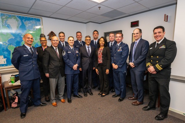Finalists for the Department of Defense Talent Management Innovation Challenge pose for a photo with the Honorable Ashish Vazirani, the acting Under Secretary of Defense for Personnel and Readiness, center, April 25, 2024, at the Pentagon,...
