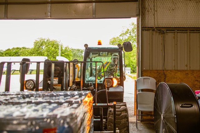 Sgt. Andrew Serna, a Dallas, Texas, resident serving with Delta Company, 700th Brigade Support Battalion, 45th Infantry Brigade Combat Team, Oklahoma Army National Guard, operates a forklift during tornado recovery efforts at the Murray County...