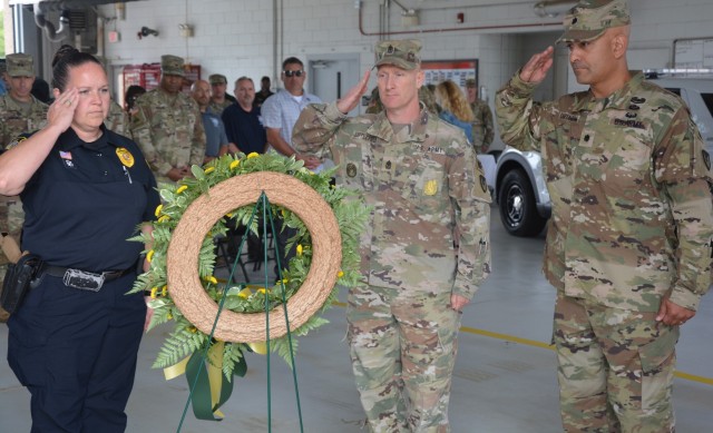 Police Chief Maryanne Dickerson, Sgt. Maj. Richard Littlefield, and Lt. Col. Henry Cartagena, Fort Eisenhower Directorate of Emergency Services, present a wreath in memory of fallen military/civilian police officers, at the opening ceremony May...