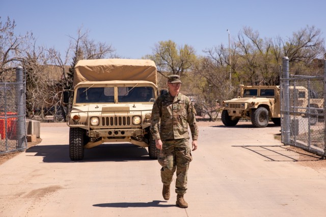 Sgt. Austin Crimmins, an intelligence analyst assigned to Signal, Intelligence and Sustainment Company, Headquarters and Headquarters Battalion, 4th Infantry Division, guides a High Mobility Multipurpose Wheeled Vehicle April 24, 2024, at Fort Carson, Colorado. Due to limited visibility in small areas, road guides are crucial to ensure the vehicle does not hit anything in the area or cause damage to the vehicle.
