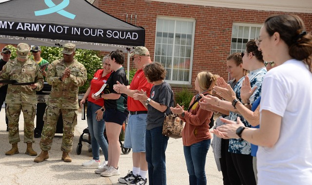 Army Corrections Brigade Command Sgt. Maj. Joshua Kreitzer and ACB Commander Col. Kevin Payne thank representatives from supporting organizations after the Army Corrections Brigade Wellness Program Volksmarch May 8 in the Frontier Conference...