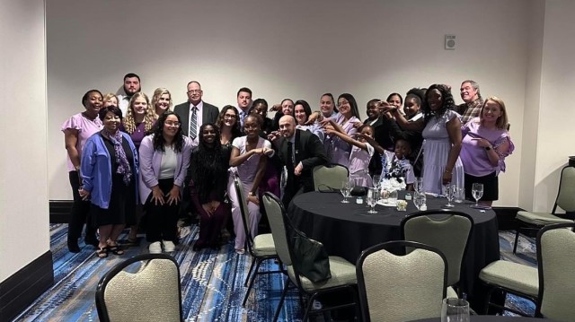 Kayla Cowart and her group of supporters in purple at Louisville, Kentucky May, 2024. Cowart had freshly won the state level of the Boys and Girls Club of America&#39;s Military Youth of the Year Competition and celebrated with close friends and...