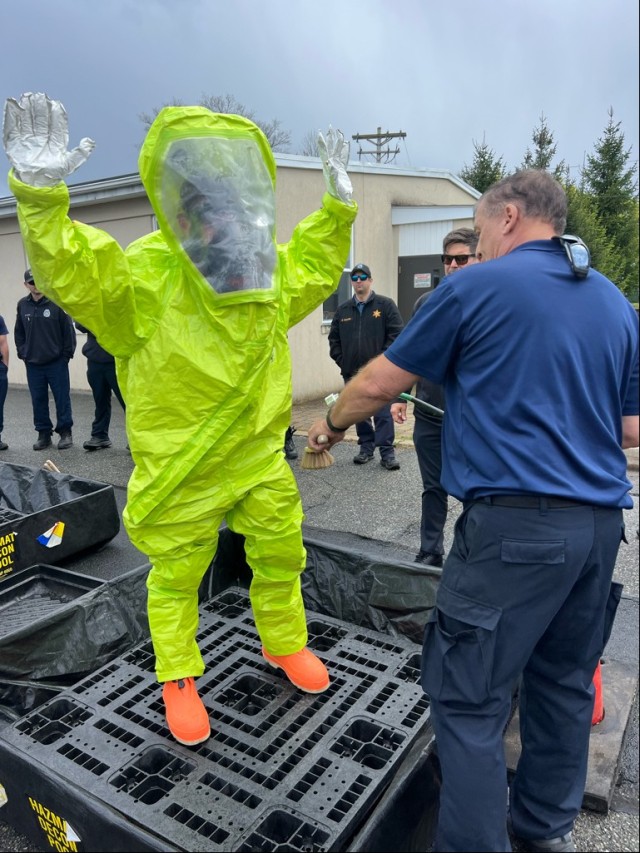 PICATINNY ARSENAL, N.J. - An International Association of Fire Fighters (IAFF) instructor explains the proper techniques to decontaminate the entrant in Level A protection suit after they performed tasks in the hot zone.  Officials with the...