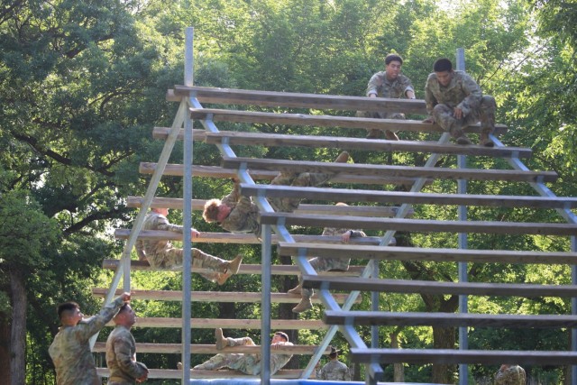 Redleg Soldiers weave through obstacle course