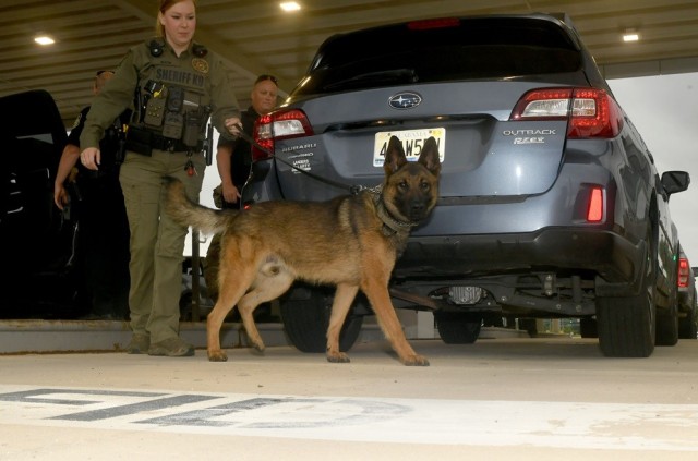 Madison County Sheriff’s Deputy Courtney Region and Redstone security forces search vehicles entering Gate 9 on May 14.