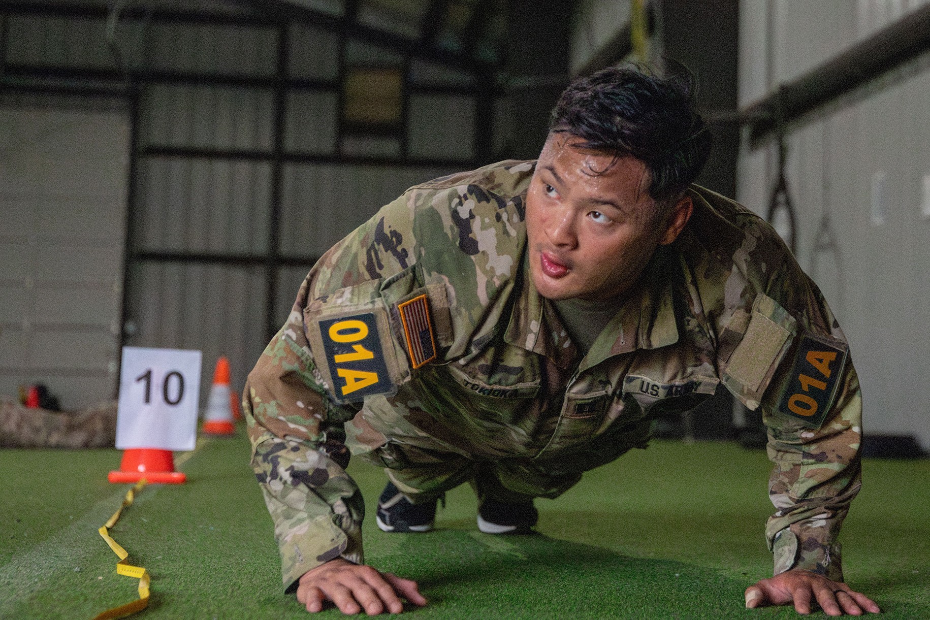 U.S. Army Cpt. Boman Tokioka, assigned to 189th Infantry Brigade, First Army Division West, conducts push-ups during the physical fitness test portion of the annual Gen. Omar N. Bradley Best Observer Coach Trainer competition in Washington, May...