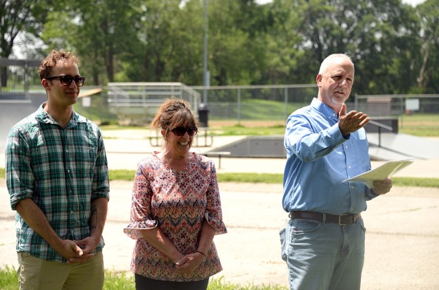 James Clark, right, father of Cody Clark, a Directorate of Public Works employee killed in an accident on post last year, is joined by his son Patrick and wife Lori as he addresses Cody's "DPW family" during the dedication ceremony for the Cody...