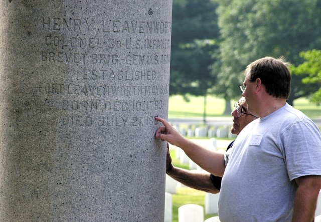 Tim Leavenworth of Ada, Michigan, and Jack Leavenworth of Howe, Texas, study the date on Col. (Brevet Brig. Gen.) Henry Leavenworth's grave during a tour stop at the Fort Leavenworth (Kansas) National Cemetery Aug. 12, 2006. Descendants of the...