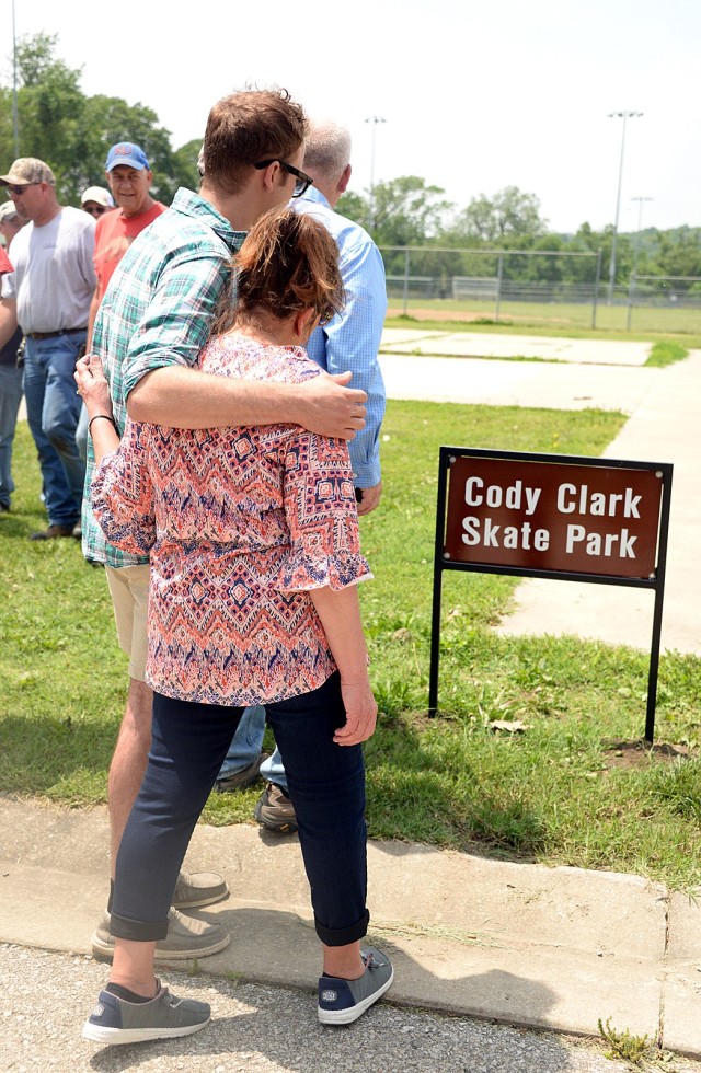 Patrick Clark puts his arm around his mother, Lori Clark, after a dedication ceremony naming the skate park after their brother/son Cody Clark May 21, 2024, behind Post Theater at Fort Leavenworth, Kansas. Photo by Prudence Siebert/Fort...