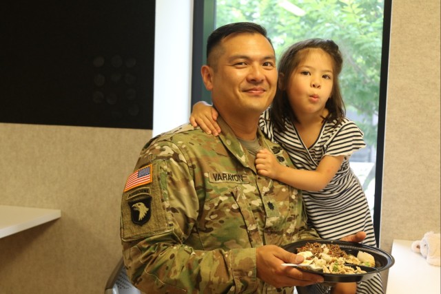 Lt. Col. Seth T. Varayon, Sr., (left) poses with his daughter Willa