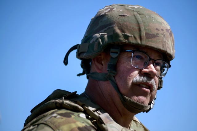 U.S. Army Staff Sgt. Terry Rutherford, a gun chief with B Battery, 2nd Battalion, 123rd Field Artillery Regiment, Illinois Army National Guard, watches as his gun crew prepares their M777 howitzer to execute a fire mission during exercise...