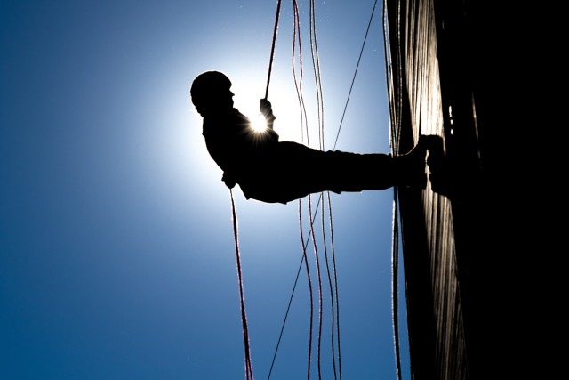 A U.S. Army Cadet with 5th Regiment, Advanced Camp, descends the rappel tower at Fort Knox, Ky., June 30, 2022. The rappel training teaches Cadets to have confidence in their gear and to work through their fears to complete the task.