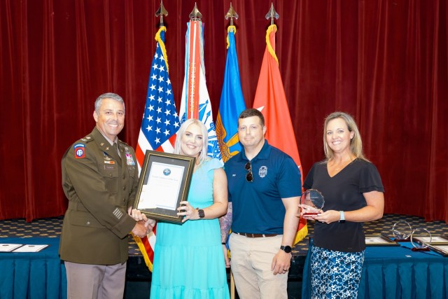 (Representatives of) Kenlie Mason is awarded the Youth Volunteer of the Year award in The Landing on May 31.