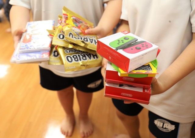 Lt. Col. Damon Saxton, the U.S. Army Garrison Japan chaplain, and other community members handed out gifts to children at the Sagamihara Minami Children’s Home in Sagamihara City, Japan, May 30, 2024. The gifts were mainly donated by religious...