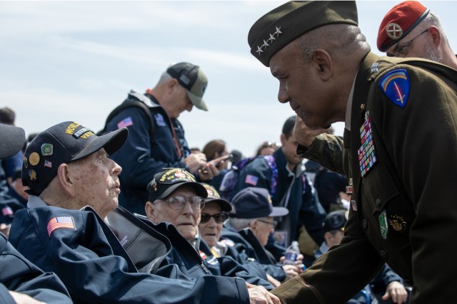 U.S. Army Gen. Darryl Williams, commanding general of U.S. Army Europe and Africa, greets WWII veteran Paul Priest, who fought in WWII with Headquarters Company, 52nd Infantry Division, 9th Armored Division, during the return of veterans for the 80th anniversary of D-Day June 3, 2024, at Deauville-Normandie airport, Deauville, France. On this historic milestone anniversary, we honor the U.S. and Allied service members who heroically went above and beyond to answer the world’s call for defense of liberty and democratic values.