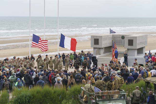 U.S. Army Soldiers and tourists attend a ceremony overlooking the beach during D-Day anniversary festivities at Omaha Beach Normandy, France., June 2, 2024. The U.S. Army and members from European allied nations are participating in the 80th...