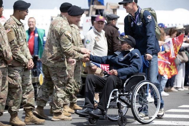 Richard Stewart, a WWII veteran, formerly a communications lineman for the 459th Signal Construction Battalion, Air Force, is welcomed by Soldiers from the 4th Infantry Division Deauville-Normandie airport, Deauville, France, June 3, 2024. Eighty...