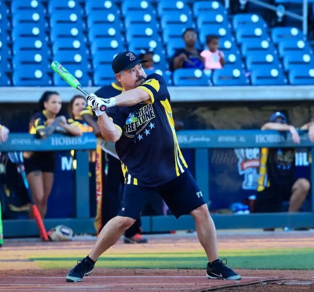 The FBI-Redstone&#39;s Johnny Sharpe braces for a hit at the 2023 Community Softball Game.