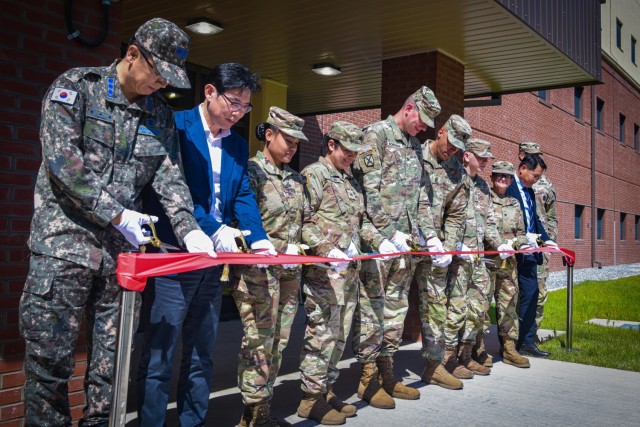 Leadership from U.S. Army Garrison Humphreys, the U.S. Army Corps of Engineers Far East District, and the Korea Ministry of National Defense and their distinguished guests opened new unaccompanied enlisted housing during a ribbon-cutting ceremony May 31, 2024, on Camp Humphreys, South Korea. These housing facilities will allow military personnel to enjoy suite-style living with many included amenities while living on base. 