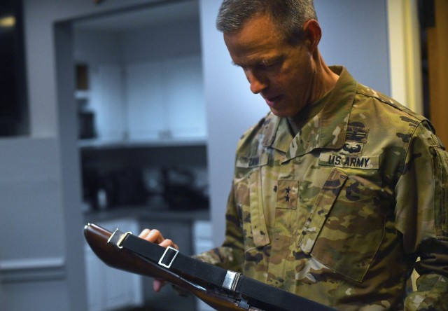 U.S. Army Maj. Gen. William Zana, director of international affairs with the National Guard Bureau, examines a ceremonial M14 rifle as he prepares to stand one final watch over the Tomb of the Unknown Soldier at Arlington National Cemetery, May...