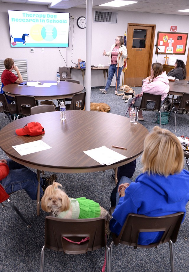 Fort Leavenworth Human Animal Bond member Scarlet Ross and her HAB-certified teammate Phyllis Diller and other HAB members gathered for the March monthly membership meeting listen to a presentation by HAB member Shelby Burnett, social worker at...
