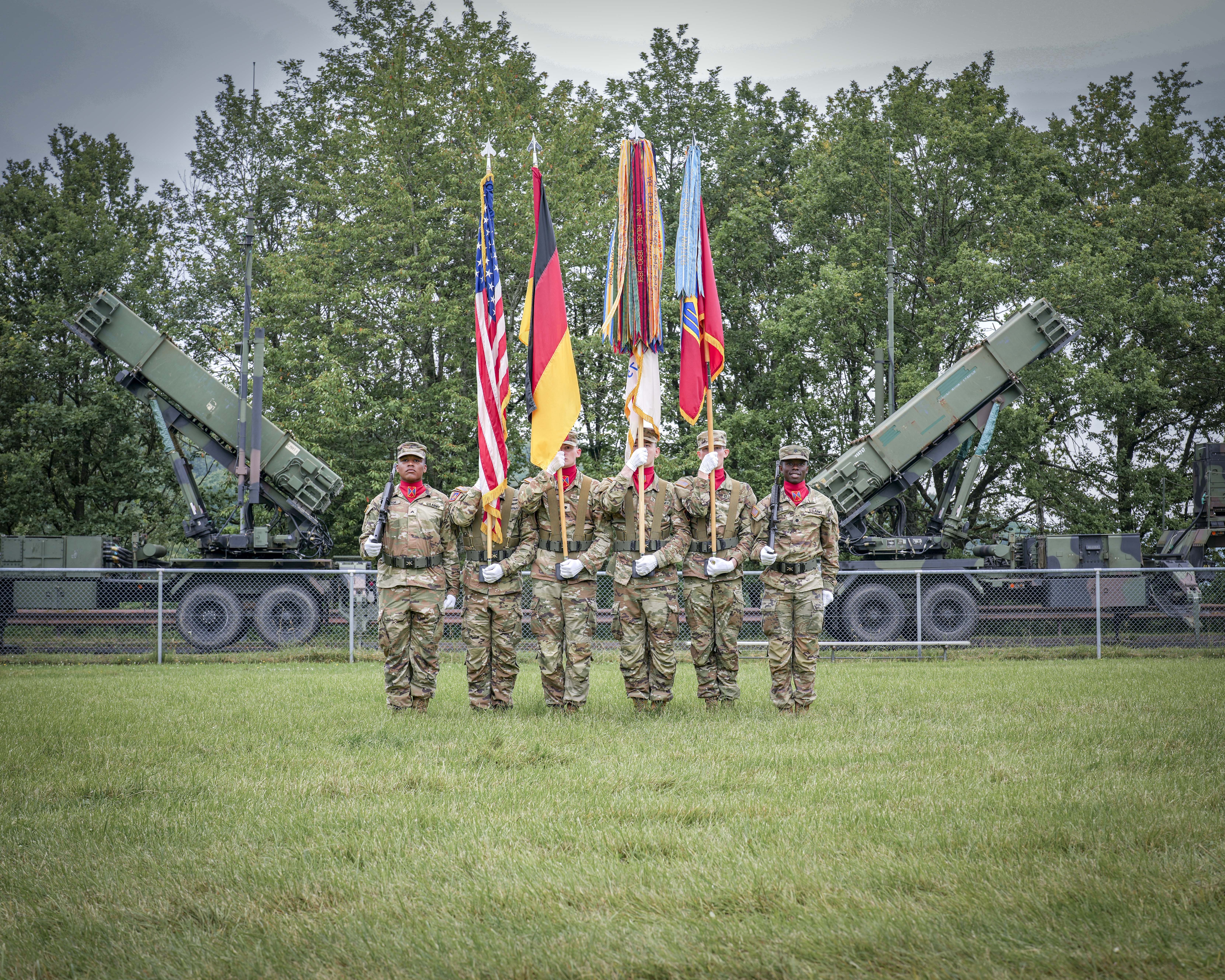 U.S. Army air defenders with 10th AAMDC color guard stand at &#34;attention&#34; in front of Patriot missile system during a change of command ceremony June 20 in Sembach, Germany.