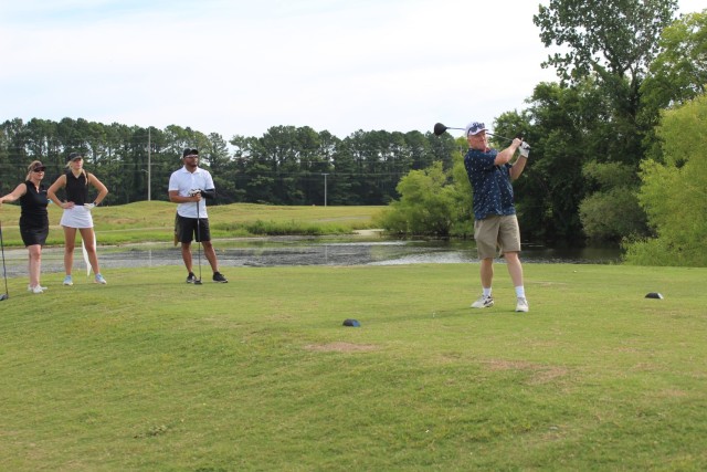 Teeing off on Warrior No. 1, from left, are teammates Dawn Winters, her daughter Kate Winters, Eugene Roberts and David Whitaker.