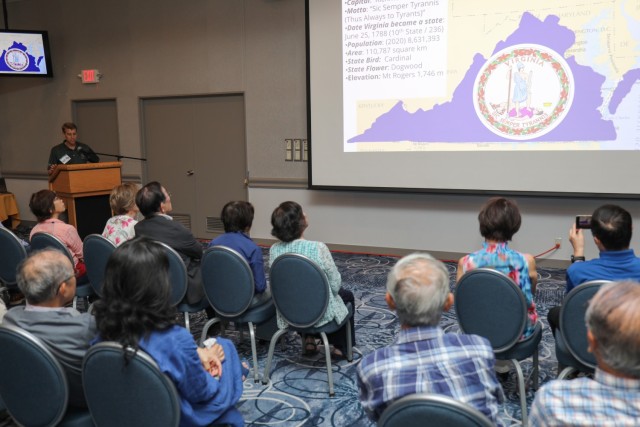 Col. Marcus Hunter, left, commander of U.S. Army Garrison Japan, provides a presentation on Virginia to members of the Japan-America Society of Central Kanagawa during a “State Day” event at Camp Zama, Japan, June 20, 2024. Hunter and Command Sgt. Maj. David A. Rio, garrison senior enlisted leader, shared details and food items from their respective home states as part of the cultural exchange.